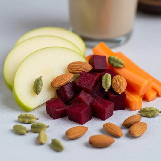 Assorted fruits and vegetables including apples, carrots, beets, and almonds on a light surface. BKH Organics ABC Malt