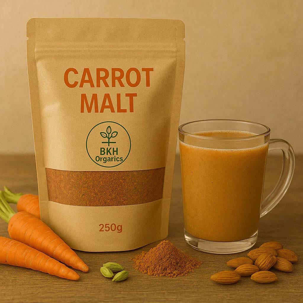 Carrot Malt package with a glass of carrot juice, carrots, and almonds on a wooden surface. BKH Organics