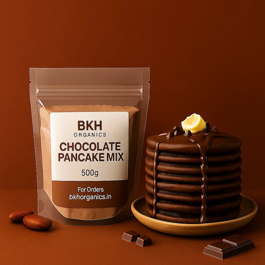 BKH Organics chocolate pancake mix package with a stack of chocolate pancakes on a brown background