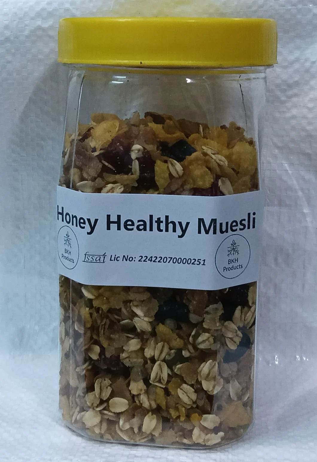 Jar of Honey Healthy Muesli with a yellow lid on a white background. Honey Muesli 250g - BKH Organics