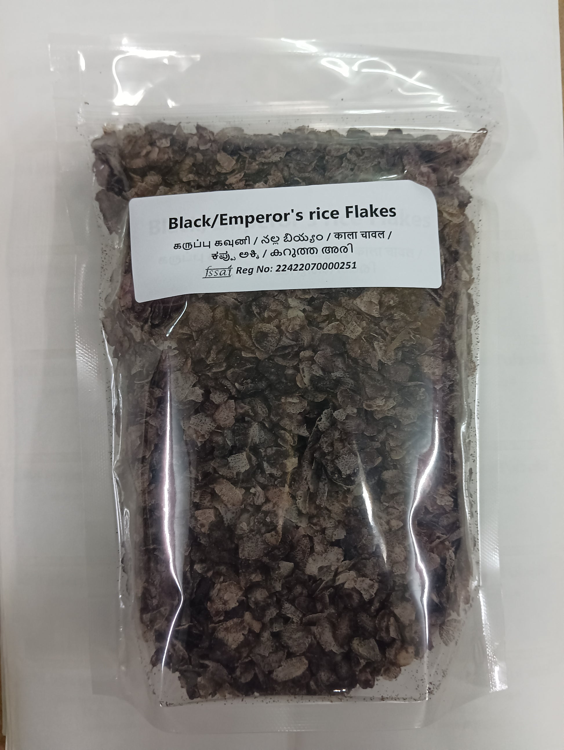 Packaged black rice flakes with a label on a white background, BKH Organics Karuppu Kavuni rice Flakes