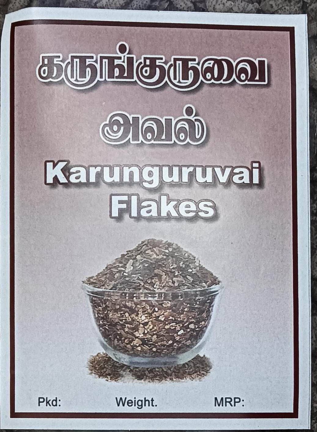 Label for Karunguruuvai Flakes with a bowl of flakes on a gray background - Karunguruvai Flakes - BKH Organics