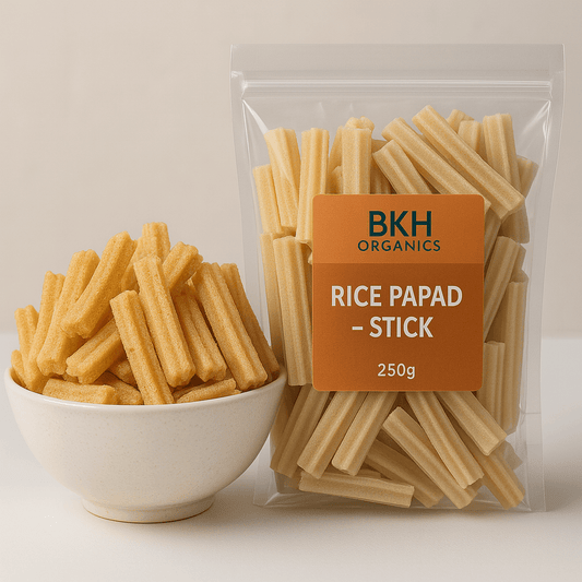 Bowl of rice papad sticks next to a package labeled BKH Organics on a light background