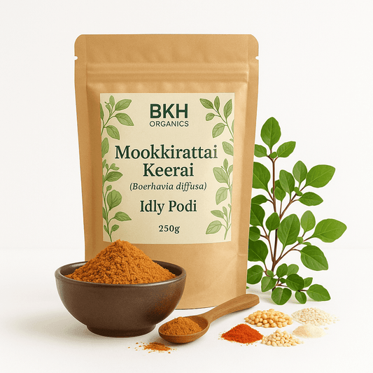 BKH Organics Mookkirattai Keerai Idly Podi package with a bowl of spice and plant on a white background