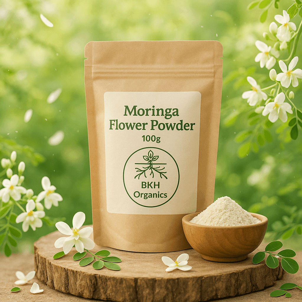 BKH Organics Moringa Flower Powder package with a small bowl of powder on a wooden surface with flowers in the background. Murungai Poo Powder 100g - BKH Organics
