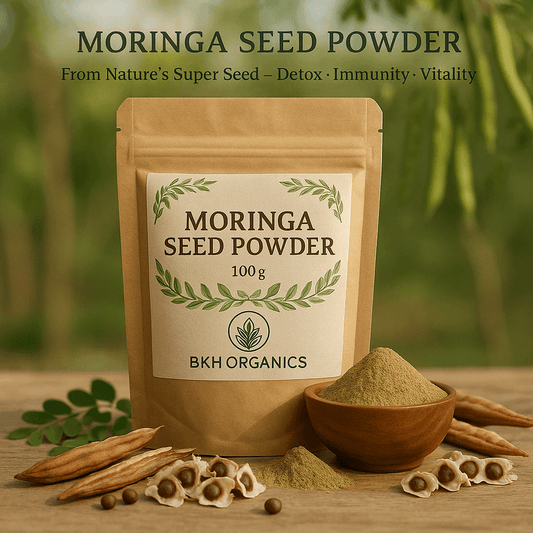 Moringa seed powder package with powder in a bowl on a wooden surface, surrounded by moringa leaves and seeds. Murungai Vidhai Powder 100g - BKH Organics