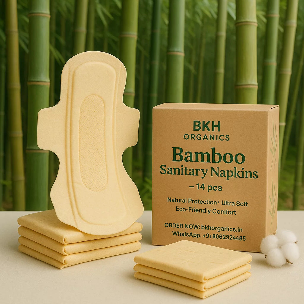 Bamboo sanitary napkins with a cardboard box labeled 'BKH Organics' against a bamboo background.