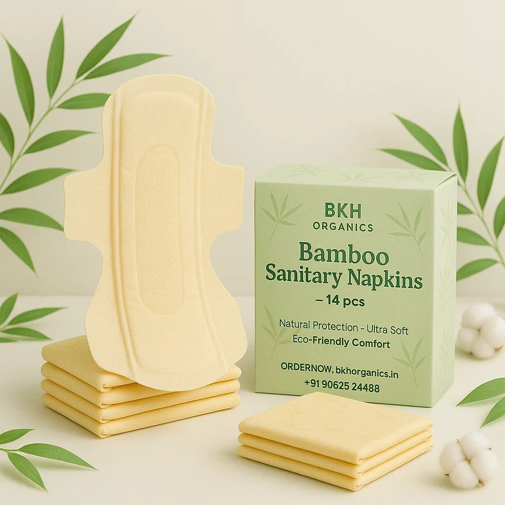 Bamboo sanitary napkins with packaging on a light background with green leaves.