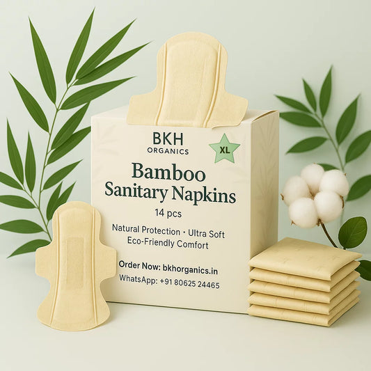 Box of BKH Organics Bamboo Sanitary Napkins XL with packaging and cotton plant on a light background