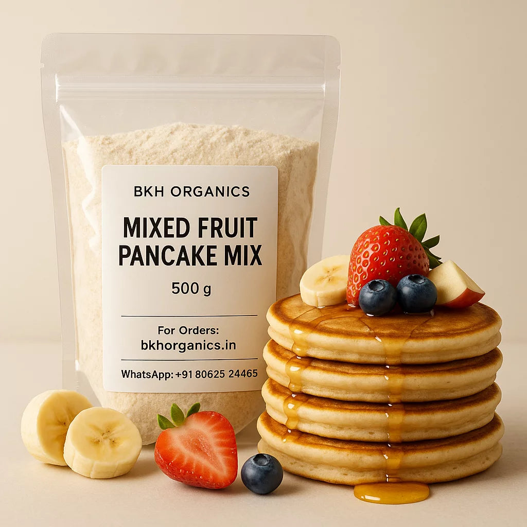 BKH Organics mixed fruit pancake mix package with a stack of pancakes and fresh fruits on a beige background
