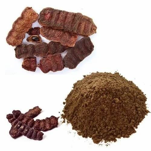 Turmeric root and ground turmeric powder on a white background