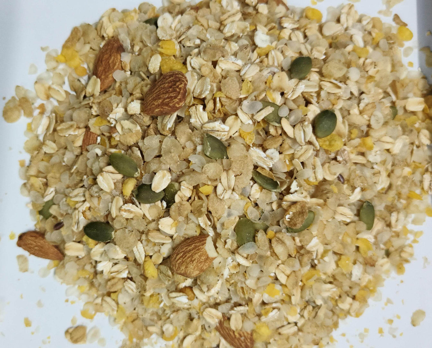 Muesli mix with oats, almonds, and seeds on a white background. Sugarfree Muesli 250g - BKH Organics