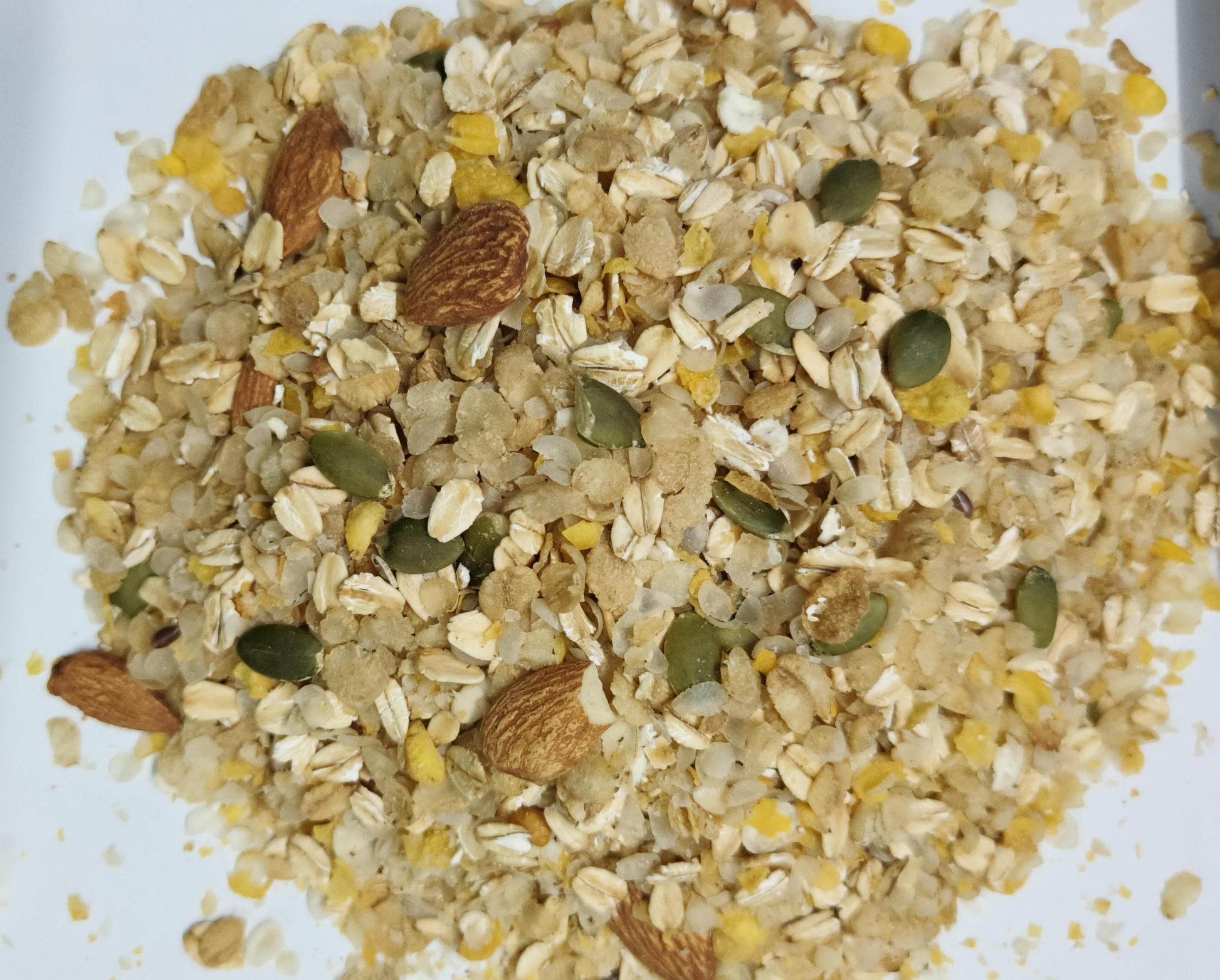 Muesli mix with oats, almonds, and seeds on a white background. Sugarfree Muesli 250g - BKH Organics