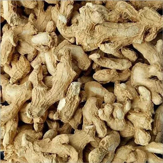 Close-up of dried ginger roots. Sukku Herbal Powder 100g - BKH Organics, dry ginger