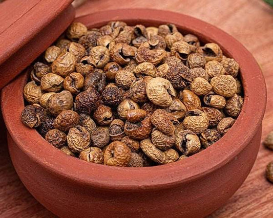 Terracotta pot filled with dried fruits on a wooden surface, Sundaikkai Vathal 250g - BKH Organics