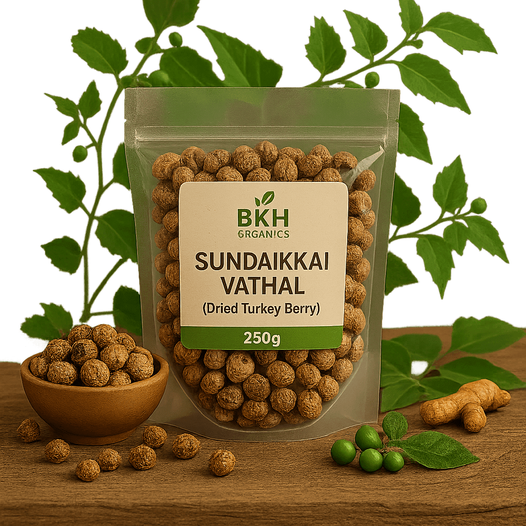 Packaged Sundaiikkai Vathal (Dried Turkey Berry) with BKH Organics label on a wooden surface with green leaves in the background.