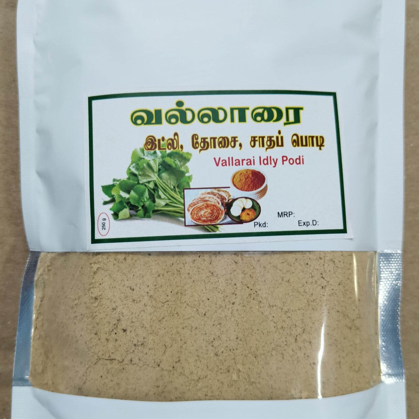 Vallarai Idly Podi packaging with a label showing ingredients and images on a white background.