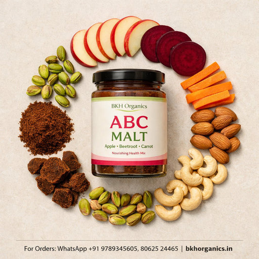Jar of ABC Malt surrounded by fruits, vegetables, and nuts on a beige background, BKH Organics