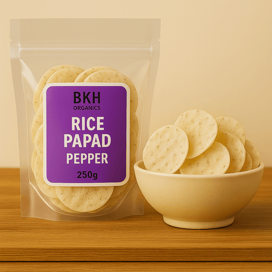 Packaged rice papad with a purple label on a wooden surface