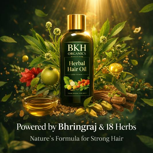 BKH Organics Herbal Hair Oil bottle surrounded by herbs and flowers on a dark background
