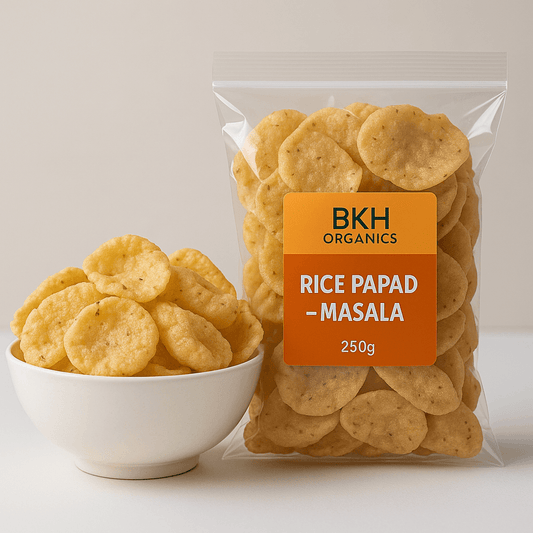 Packaged rice papad with a bowl of rice papad on a light background