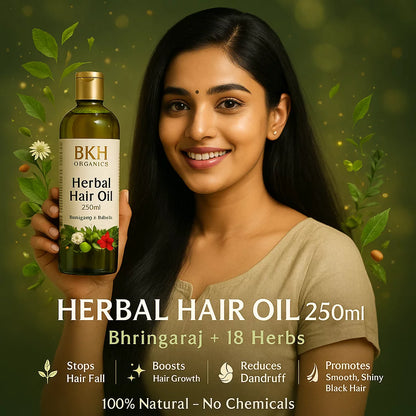 Woman holding a bottle of BKH Organics Herbal Hair Oil with green leaves and flowers in the background