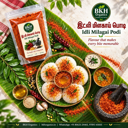 BKH Organics Idli Milagai Podi (தமிழ்: இட்லி மிளகாய் பொடி, తెలుగు: ఇడ్లీ కారం పొడి, ಕನ್ನಡ: ಇಡ್ಲಿ ಚಟ್ನಿ ಪುಡಿ, മലയാളം: ഇഡ്ഡലി പൊടി, ತುಳು: ಇಡ್ಲಿ ಪೊಡಿ) served with soft idlis, gingelly oil, coconut chutney, and sambar