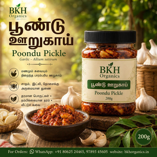 BKH Organics Poondu Pickle jar with garlic and leaves on a wooden surface