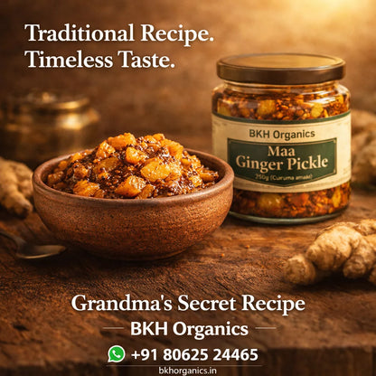Bowl of ginger pickle with a jar labeled 'Maa Ginger Pickle' by BKH Organics on a wooden surface.