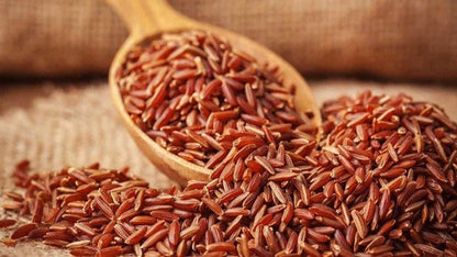 Red rice grains with a wooden spoon on a rustic background Mappillai Samba Rice 1kg - BKH Organics