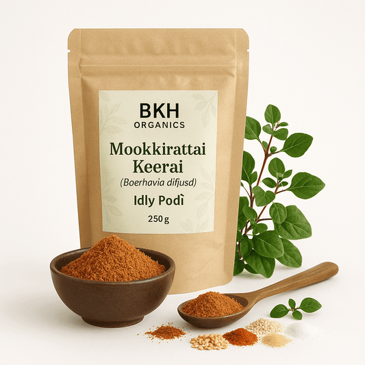 BKH Organics Mookkirattai Keerai Idly Podi packaging with a bowl of spice, spoon, and plant on a white background