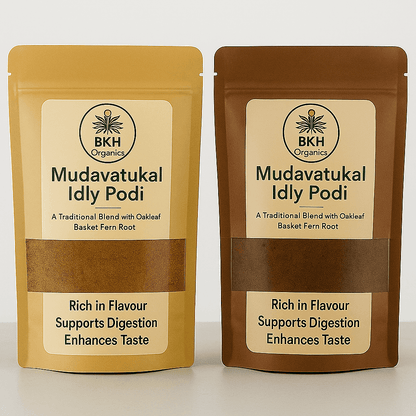 Two packages of BKH Organics Mudavatukal Idly Podi on a white background - Close-up of Oakleaf Basket Fern Root, - Mudavatukal Kizhangu