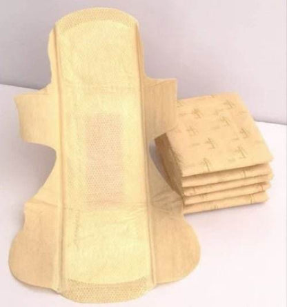 Stack of yellow sanitary pads on a white background. Bamboo Sanitary Napkins 14pc - BKH Organics 