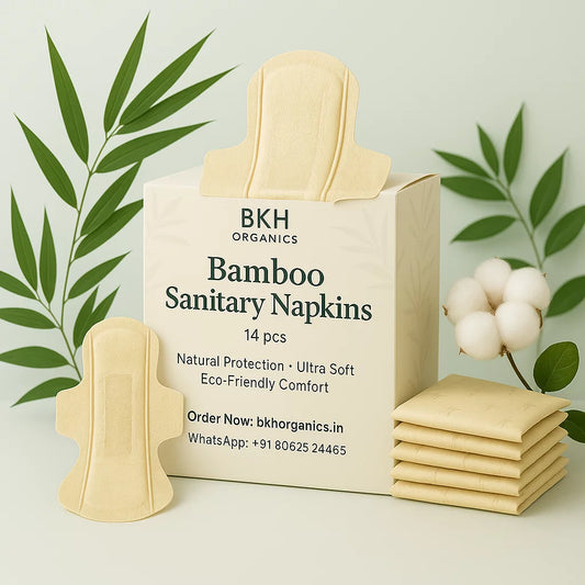 Box of BKH Organics bamboo sanitary napkins with packaging and napkins on a light background