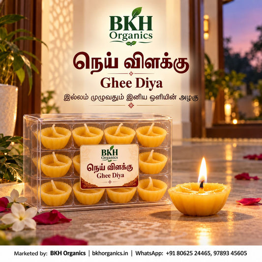 BKH Organics Pure Ghee Diya (தமிழ்: நெய் விளக்கு, తెలుగు: నేతి దీపాలు, ಕನ್ನಡ: ತುಪ್ಪದ ದೀಪಗಳು, മലയാളം: നെയ്യ് വിളക്ക്, ತುಳು: ನೆಯ್ಯಿದ ದೀಪೊಲು) clear container box of ready-to-light pure cow ghee wicks with a glowing diya and rose petals