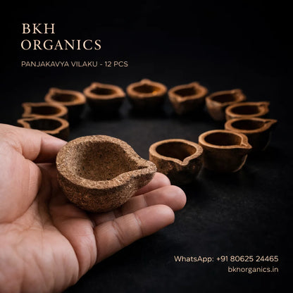 BKH Organics clay lamps held in a hand with product display in the background