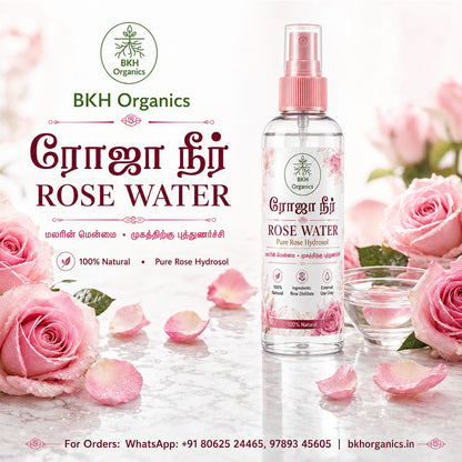 A bottle of BKH Organics Rose Water pure rose hydrosol stands on a marble surface surrounded by pink roses and petals, with promotional text and the BKH Organics logo on a soft pink background.