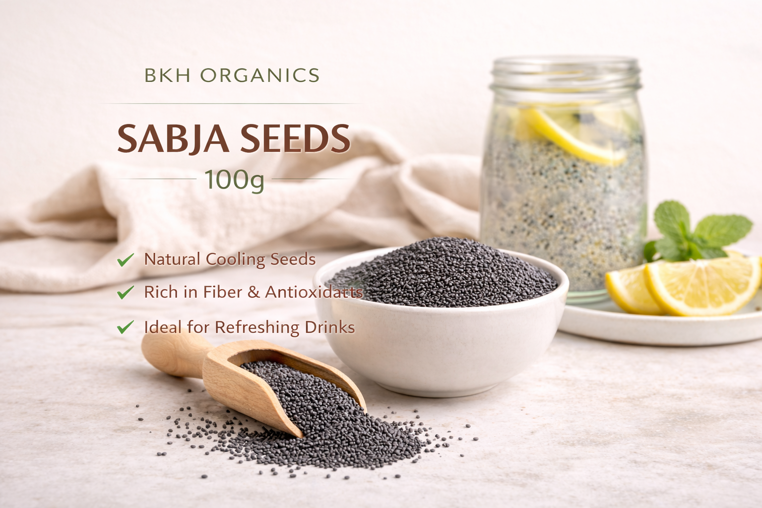 Bowl of sabja seeds with a wooden scoop on a light surface, featuring BKH Organics branding.