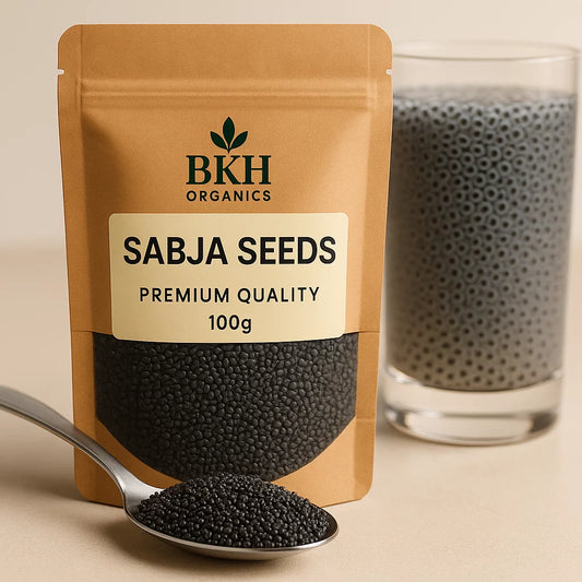 BKH Organics Sabja Seeds packaging with a spoonful of seeds and a glass container in the background.