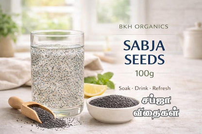 Glass of water with sabja seeds, bowl of seeds, and wooden scoop on a light surface with 'BKH Organics' branding.