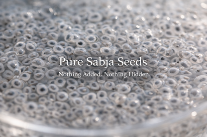 Close-up of sabja seeds with text 'Pure Sabja Seeds - Nothing Added, Nothing Hidden'.