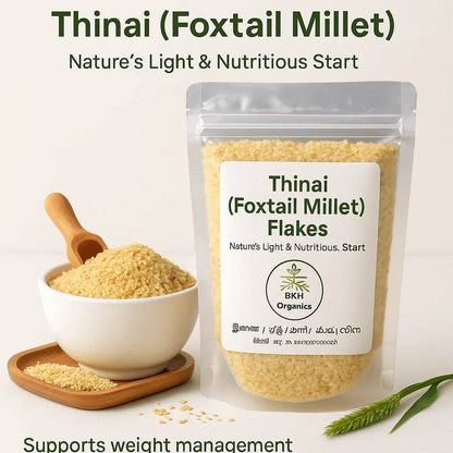 Packaging of Thinai (Foxtail Millet) flakes with a bowl of flakes and a scoop on a light background. Thinai Flakes (Foxtail) - BKH Organics
