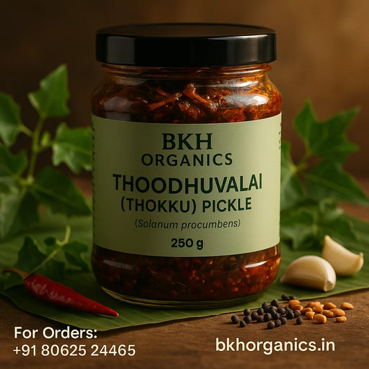 Jar of BKH Organics Thoodhuvalai pickle with label and ingredients on a wooden surface, Solanum procumbens