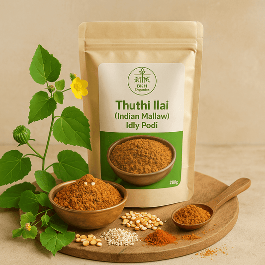 BKH Organics Thuthi Ilai Idly Podi packaging with ingredients on a wooden board