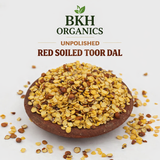 Unpolished red soiled toor dal in a bowl with BKH Organics branding on a light background