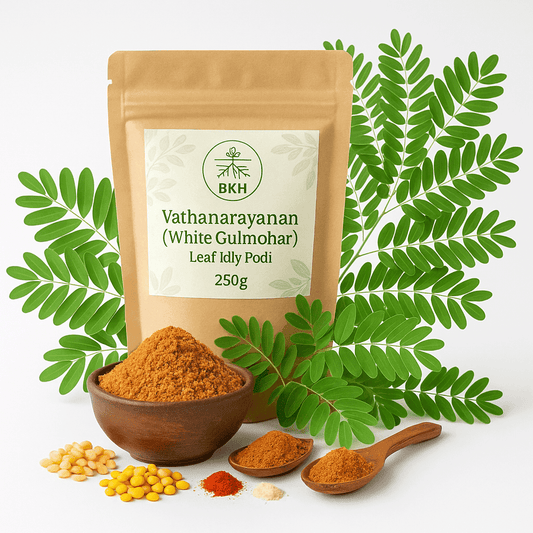 BKH Vathanarayanan White Gulmohar Leaf Idly Podi packaging with leaves and spices on a white background