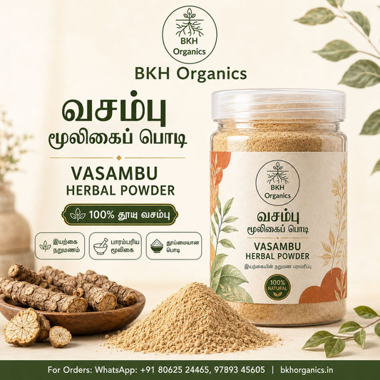 BKH Organics Vasambu Herbal Powder in a clear plastic jar with a white label and orange botanical illustrations, shown beside loose herbal roots and a pile of powder on a light beige background with decorative leaves.